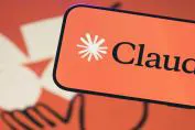 Close-up of the Claude logo on a vibrant orange background