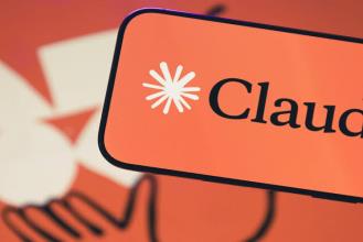 Close-up of the Claude logo on a vibrant orange background