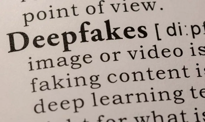 Close-up of a dictionary entry defining 'Deepfakes' with detailed explanation about manipulated images and videos.