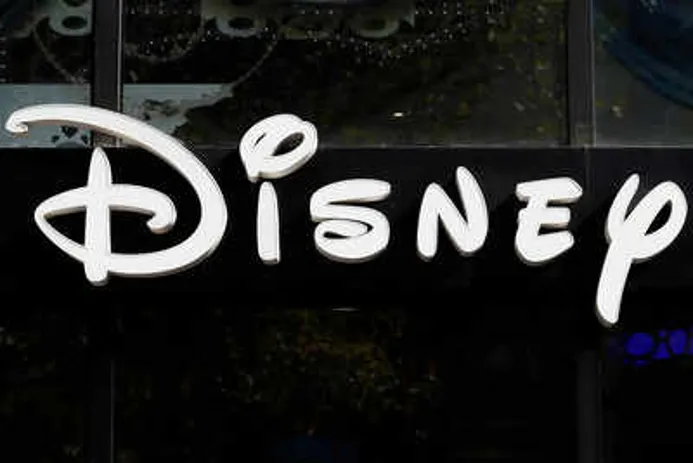 Close-up of the Disney logo sign displayed on a storefront.