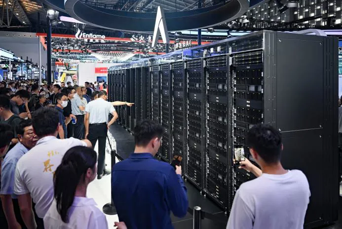 Crowd observing server displays at a technology exhibition
